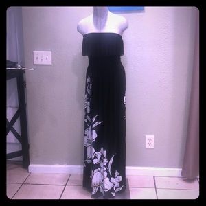 Black strapless maxi with large floral print.